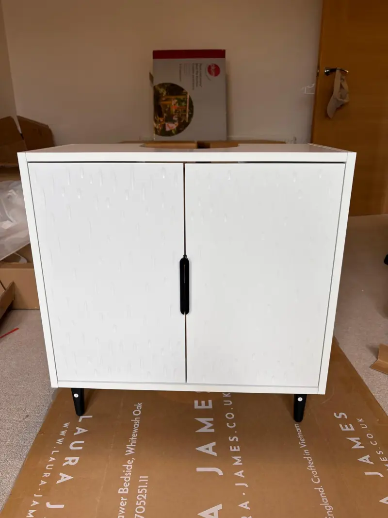 White flat pack storage cabinet professionally assembled by Bricket Wood Handyman in a customer's home.